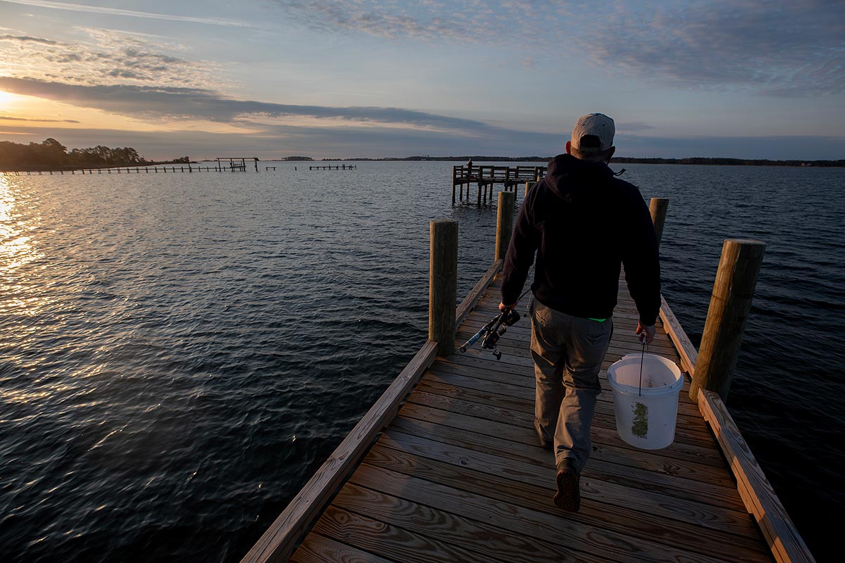 Man walking on New fishing pier at Captain Sinclair’s 